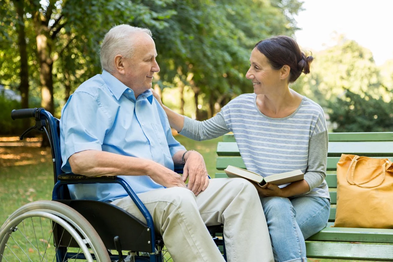 A support worker and a participant together outdoors